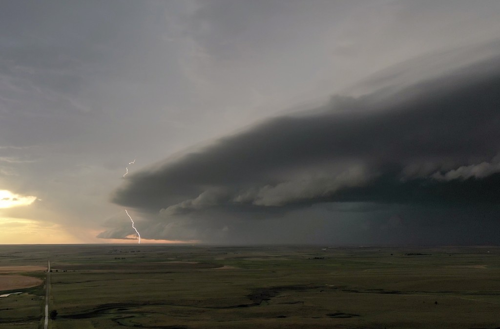 Severe storms with damaging winds and large hail surging southward out of the Oklahoma Panhandle.